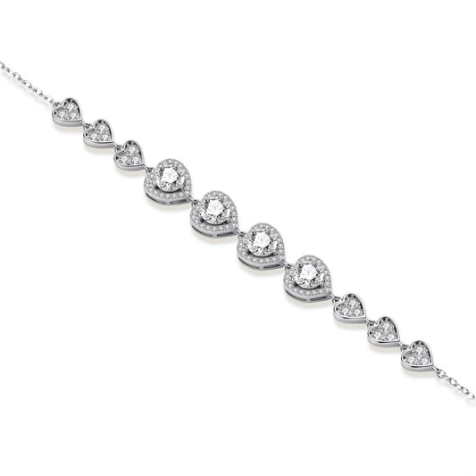 Sterling silver bracelet with graduated heart-shaped links and sparkling moissanite stones in VVS1 clarity on white background.