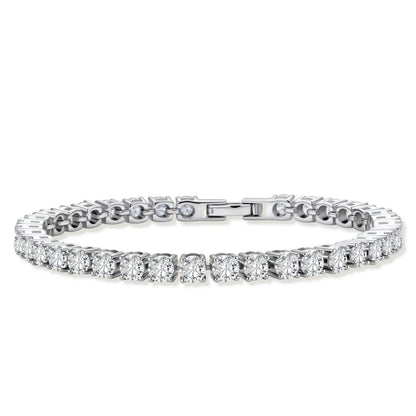 Sterling silver tennis bracelet with continuous row of brilliant moissanite stones and secure clasp closure on cream background.