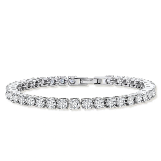 Sterling silver tennis bracelet with continuous row of brilliant moissanite stones and secure clasp closure on cream background.