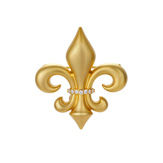 Ornate gold-plated fleur-de-lis brooch with crystal band detail on white background, showing brushed metal finish.